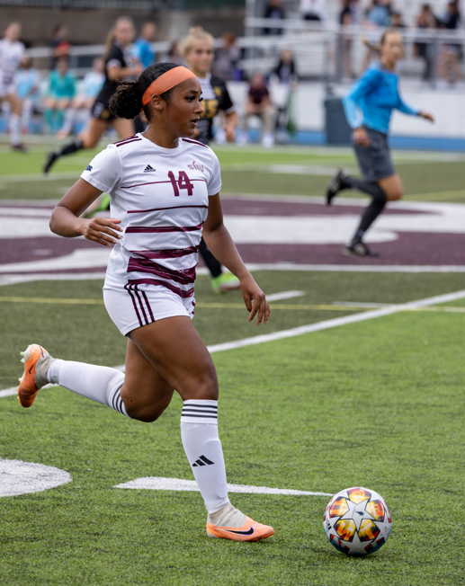 student playing soccer