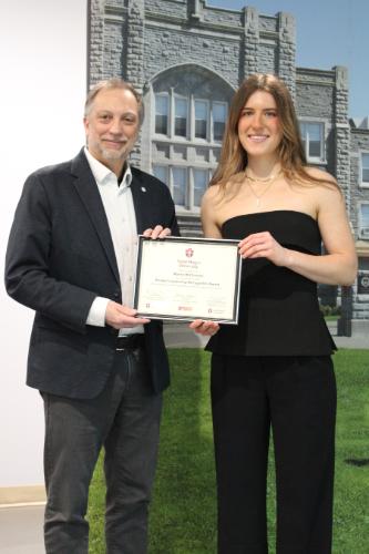 Maria accepting the SLRA certificate