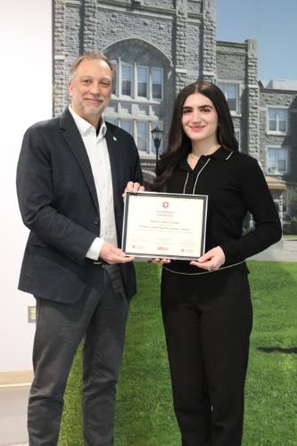 Rebecca accepting the SLRA certificate